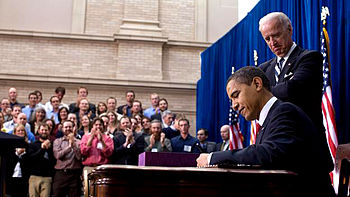 Barack Obama signs American Recovery and Reinvestment Act of 2009 on February 17.jpg